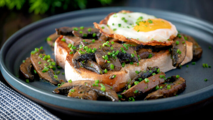 Devilled mushrooms on toast served with a fried egg and snipped chives.