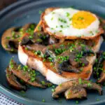 Easy devilled mushrooms on toast with a fried egg.