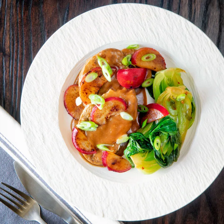 Pork tenderloin with a fresh plum sauce and steamed pak choi.