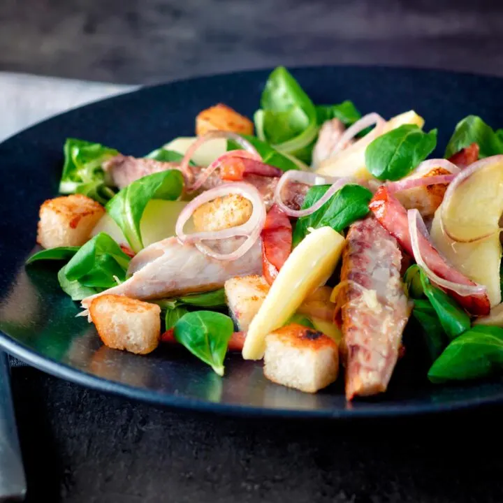 Smoked mackerel salad with apple, bacon, shallots and croutons.