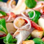 Smoked mackerel salad with apple, bacon and croutons.