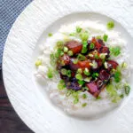 Overhead Vietnamese pork belly influenced by thit ba chi kho served with rice.