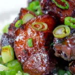 Close up Vietnamese pork belly influenced by thit ba chi kho served with rice.