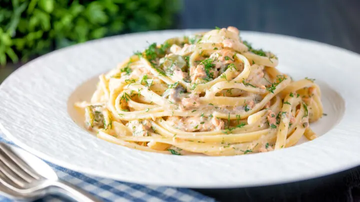 Canned salmon pasta with creme fraiche, cornichons and a fresh dill garnish.