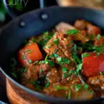 Close up Indian influenced lamb jalfrezi curry with red peppers garnished with fresh coriander featuring a title overlay.