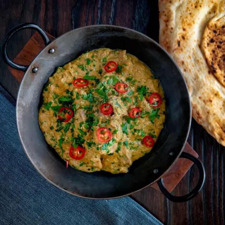 Indian influenced lamb pasanda almond and yoghurt curry garnished with fresh chilli and coriander.