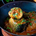 Indian influenced mackerel curry served in a karai.