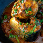 Close up Indian influenced mackerel curry served in a karai.