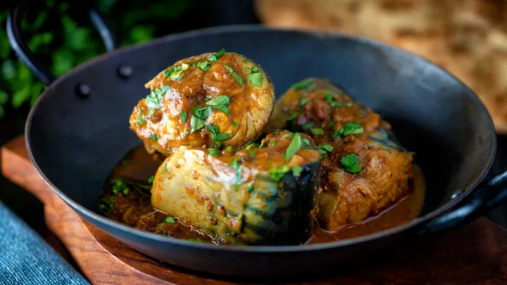 Spicy Goan influenced mackerel curry served in a karai.