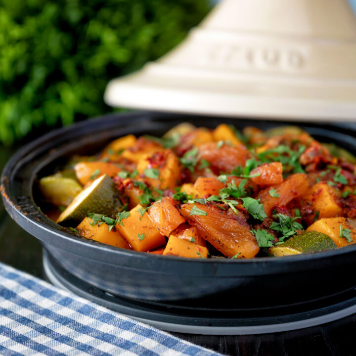 Moroccan influenced vegan vegetable tagine with squash, courgette and dried apricots.