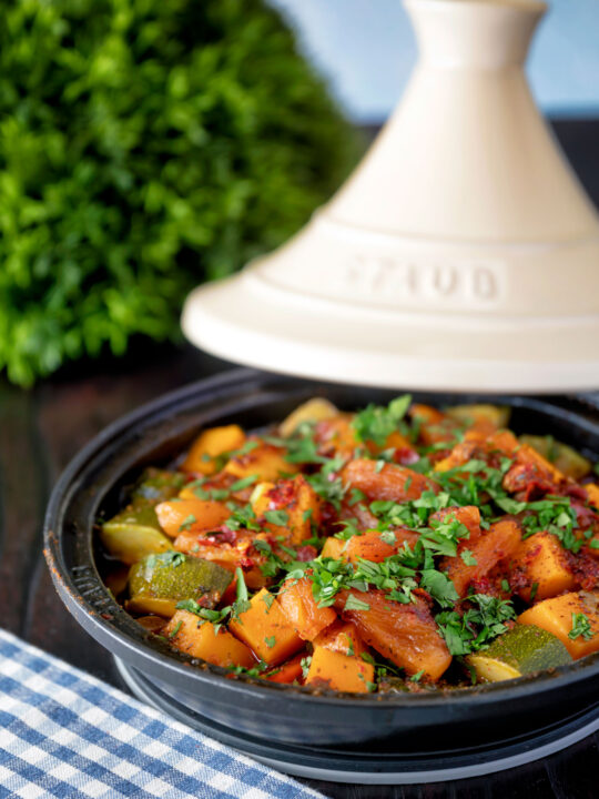 Moroccan influenced vegan vegetable tagine with squash and courgette.