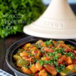 Moroccan influenced vegan vegetable tagine with squash and courgette featuring a title overlay.