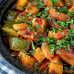 Close up Moroccan influenced vegan vegetable tagine with squash and courgette.
