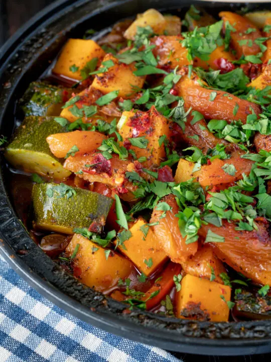 Close up Moroccan influenced vegan vegetable tagine with squash and courgette.