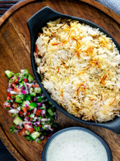 Baked vegan mushroom biryani served with mint raita and kachumber salad.