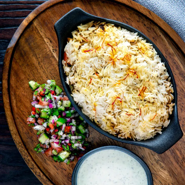 Baked vegan mushroom biryani served with mint raita and kachumber salad.