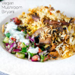 Vegan mushroom biryani served with raita and kachumber salad on a plate featuring a title overlay.