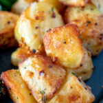 Close up parmentier potatoes with rosemary and garlic.