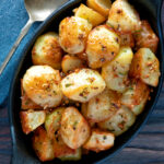 Overhead Parmentier potatoes or mini roast potatoes with rosemary and garlic.