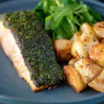 Parmentier potatoes or mini roast potatoes served with herb crusted salmon.