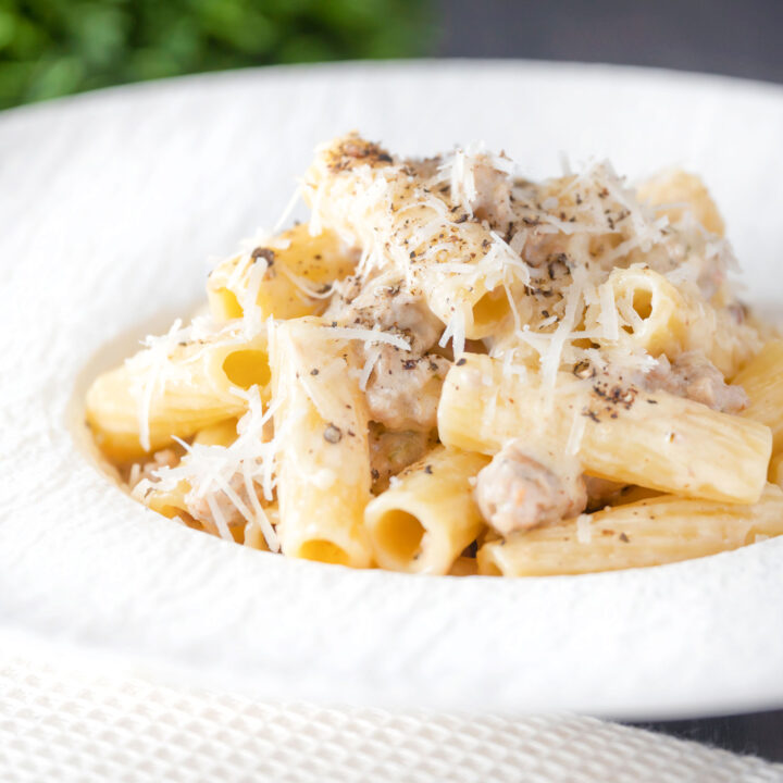 Pasta alla Norcina made with penne rigatoni garnished with pepper and parmesan cheese.
