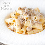 Pasta alla norcina with black pepper and fresh parmesan cheese featuring a title overlay.