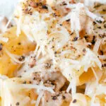 Close up pasta alla norcina with black pepper and fresh parmesan cheese.