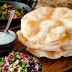 Freshly cooked poppadoms or papad served as part of an Indian spread.
