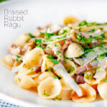 Braised and shredded rabbit ragu served with orecchiette pasta and fresh parsley featuring a title overlay.