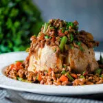 Savoury minced beef with green beans served over a jacket potato.