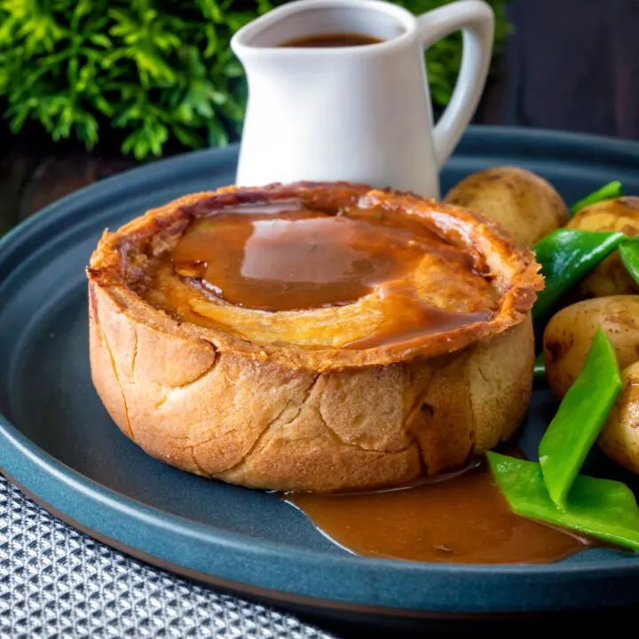 Traditional Scotch pie served with lamb gravy, potatoes and runner beans.