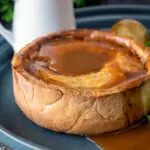 Traditional Scotch meat pie served with lamb gravy.