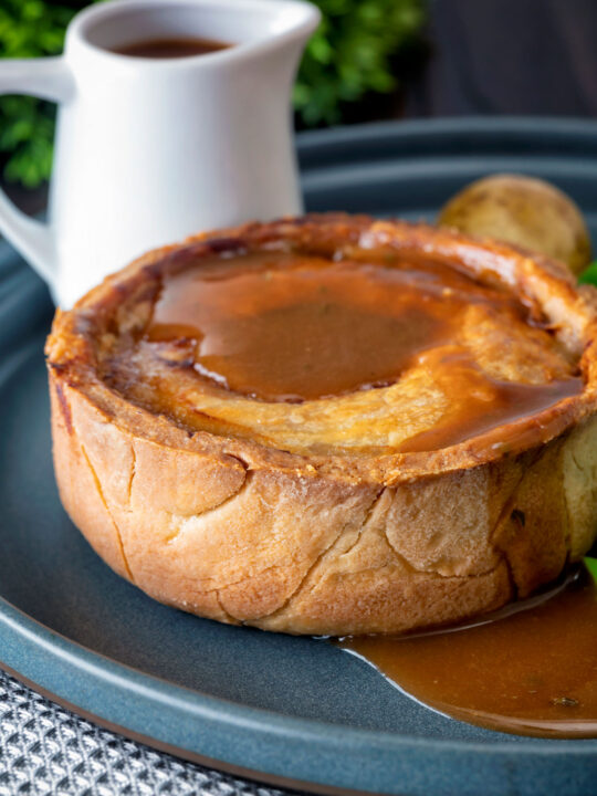Traditional Scotch meat pie served with lamb gravy.