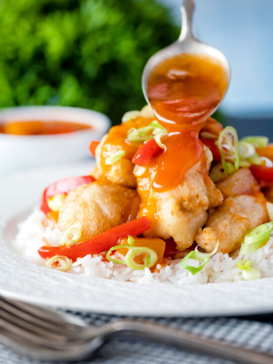 Chinese takeaway style sweet and sour sauce pored over crispy fried chicken balls.