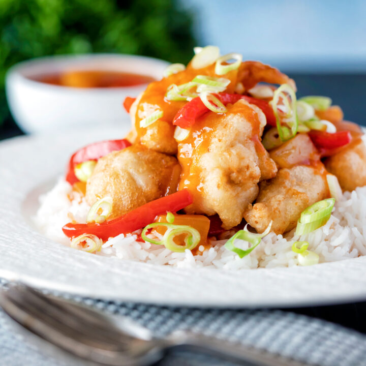 Chinese takeaway style crispy fried sweet and sour chicken balls served with rice.