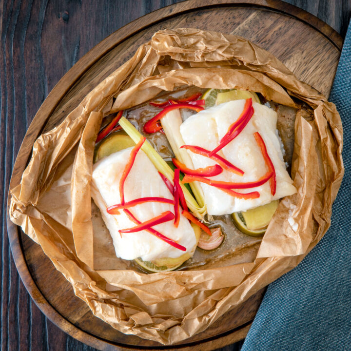 Cod loin cooked en papillote with garlic, ginger, chilli, fish sauce and rice wine vinegar.