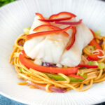 Cod loin cooked en papillote served with sweet chilli noodles.