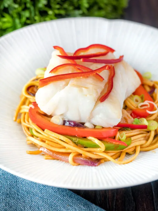 Cod loin cooked en papillote served with sweet chilli noodles.