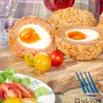 Oven baked scotch eggs cut open to show a jammy yolk featuring a title overlay.