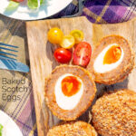 Overhead oven baked Scotch eggs with cherry tomatoes featuring a title overlay.