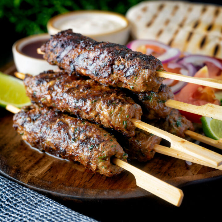 Lebanese influenced minced beef kofta kebabs served with salad, pita bread and sauces.