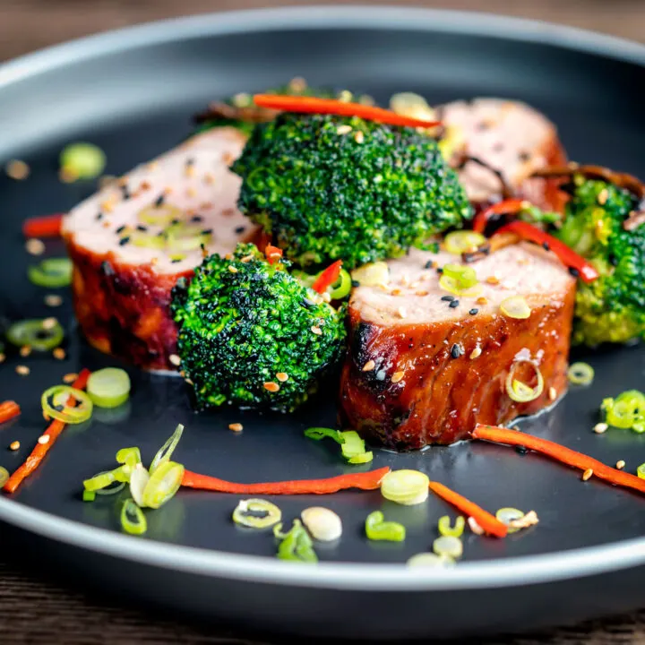 Char siu pork tenderloin, or Chinese BBQ pork served with broccoli and chilli.