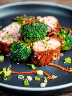 Char siu pork tenderloin, or Chinese BBQ pork served with broccoli stir fry and chilli.