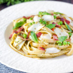 Cod pasta with pesto, peas and bacon.