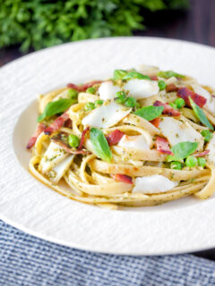 Cod pasta with pesto, peas and bacon.