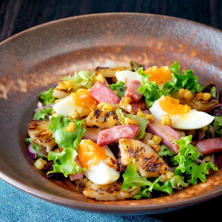 Gammon salad with seared pineapple, boiled eggs and potatoes with a mustard dressing.