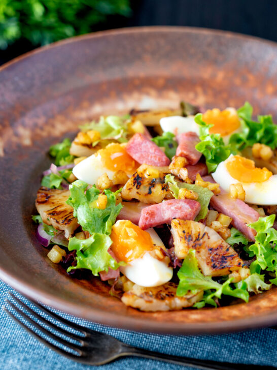 Gammon salad with seared pineapple, boiled eggs and potatoes.