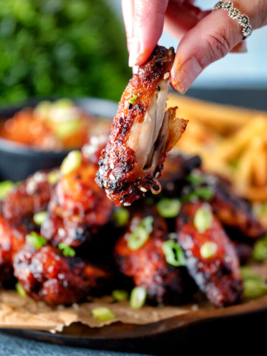 Close up Korean chicken wings showing the meat inside a cooked wing.