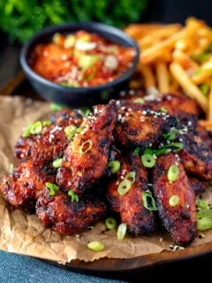 Korean influenced chicken wings served with French fries and kimchi.