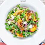 Overhead peach and feta cheese salad with puy lentils and rocket or arugula featuring a title overlay.